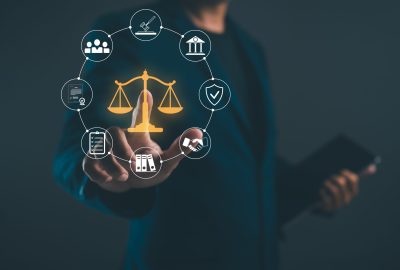 A,Person,Holds,A,Digital,Representation,Of,Justice,Scales,,Surrounded